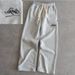 2025 New Trendy Line Art English Drawstring Wide-Leg White Black Youth Pants_desvips.com