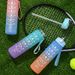 Gradient color frosted plastic sports cup portable rope portable fitness sports water bottle bouncing straw space cup_desvips.com